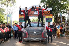 Team Mitsubishi Ralliart celebrates after winning overall championship