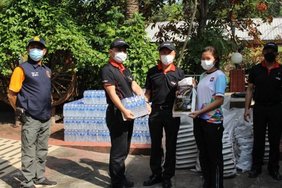 YTRC employees distributing relief packages to local villagers