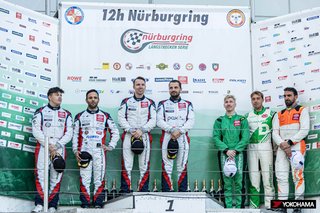 NLS Round 7 winners Christian Krognes (center left) and Jakub Giermaziak (center right) on the podium with teammates and 2nd place finishers Niklas Krütten (far left) and Dylan Pereira (second from left)